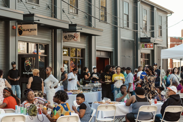 Neighbors gather at SCLT's Block Party on October 28, 2023, to celebrate the three new food businesses that are making their homes at 404 Broad Street.