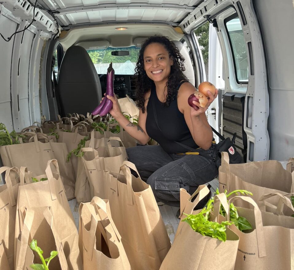 SCLT’s Food Program Coordinator Kakeena Castro fills the van with local produce shares before making a delivery.